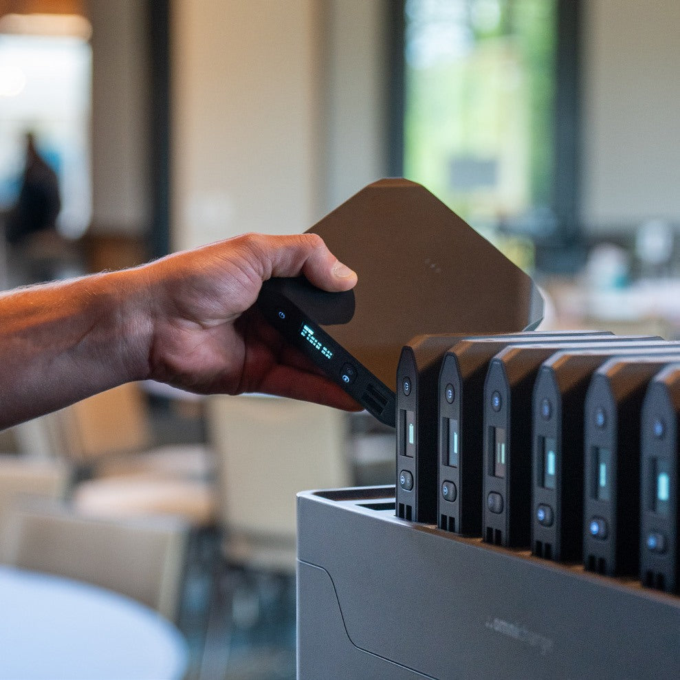 Participant grabbing a power bank from the Power Station