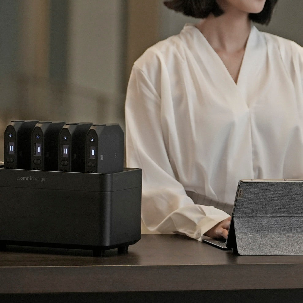 Employee at a desk with an Omni Power Station