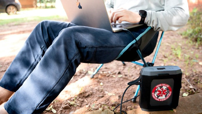 Working on a laptop outdoors powered by an Omni Ultimate